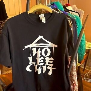 “Ho Lee Chit” one of a kind unisex Gildan 100% Heavy Cotton Black T-Shirt. Med